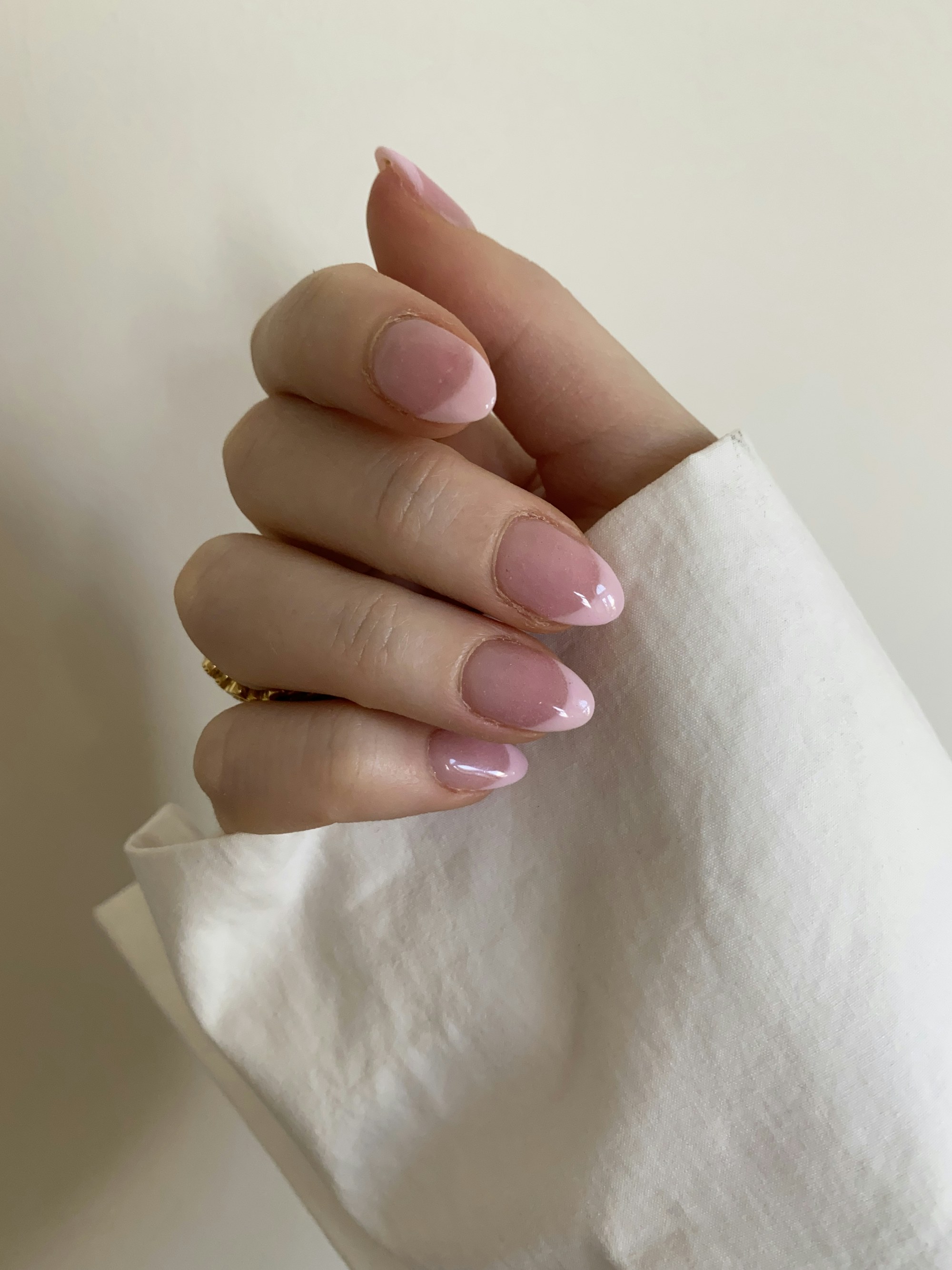 Short almond nails with a soft pink French tip