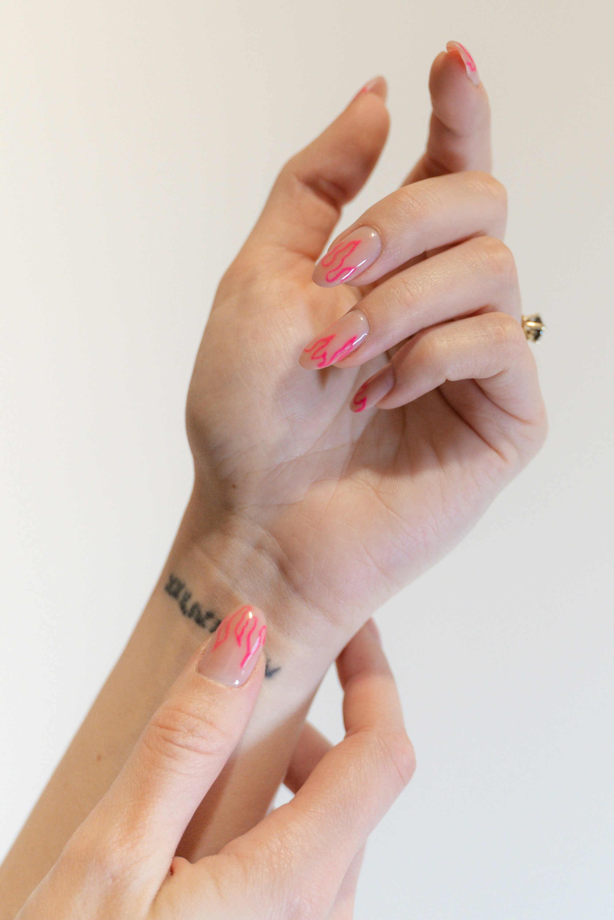 Natural almond nails with fine pink line art